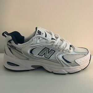 New balance 530, size 7 men’s (9 in W). Navy blue, never worn.